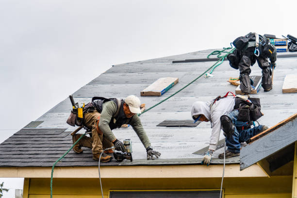 Professional Storm Damage Roof Repair technician working in Marquette, MI